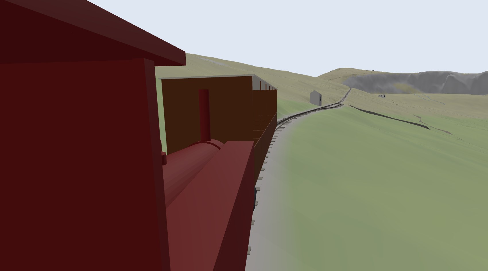 From the footplate of the Snowdon engine, looking up past the boiler and the carriage to the line climbing towards Halfway